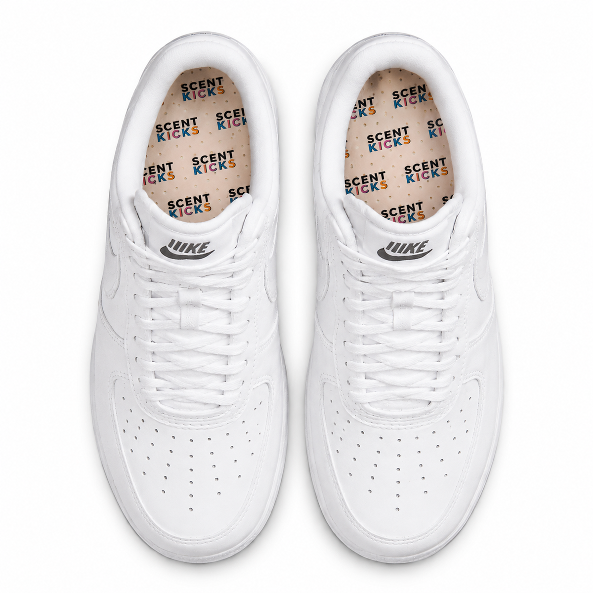 Pair of white sneakers with scent kicks insole inside on a white background