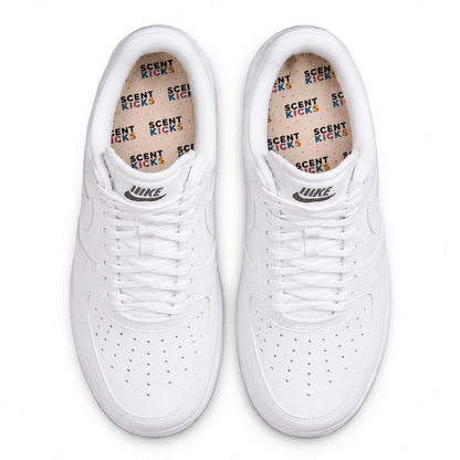 Pair of white sneakers with scent kicks insole inside on a white background